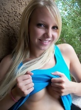 Teacher in blue takes panties aside spreading pussy lips outdoors
