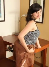 Solo Mature Pussies pics of slim brunette showing bush in the cabinet