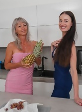 Lesbian duo enjoying fingering and licking in the kitchen