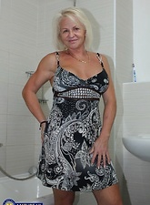 A mature slut goes to the bathroom where she gets naked