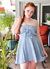 Pale redhead plays with her hair on top of her pussy