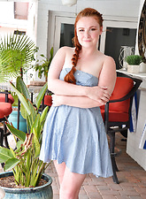 Pale redhead plays with her hair on top of her pussy