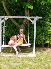 Milf Lesbian Tease On Garden Swing