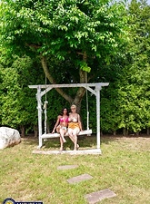 Milf Lesbian Tease On Garden Swing