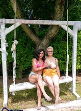 Milf Lesbian Tease On Garden Swing