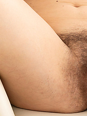 Mature nude solo tease with hairy pussy, natural tits, spread pose