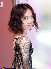 Big booty brunette is naked and plays with her MILF pussy
