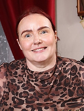 Mature milf teases topless with saggy tits and bushy pussy in raw solo spread pose