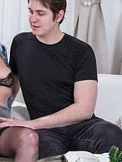 Mature blonde in lingerie and stockings spreads legs wide for a raw pussy out tease