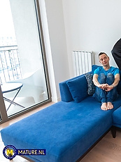 Mature cougar in black leather skirt and stockings teases tits out and booty out