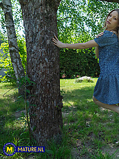 Amateur outdoor solo tease in blue dress with booty out