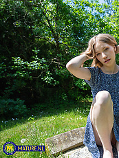 Amateur outdoor solo tease in blue dress with booty out