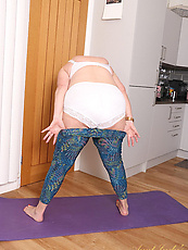 Mature yoga granny undresses for naked solo fingering shaved pussy