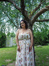 Mature curvy garden tease with saggy tits, white panties peek and big booty bent over