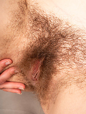 Nude babe with hairy pussy and natural tits in raw solo tease and spread pose