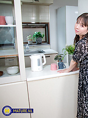 Mature Asian babe in floral lingerie gets groped and squeezed in kitchen tease