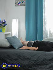 Mature brunette cougar in black lace lingerie and stockings with tits out