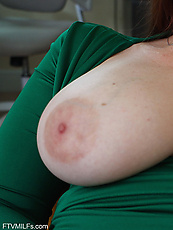 Milf solo tease in tight green dress, big tits out and shaved pussy