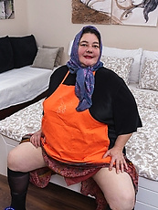 Granny and babe skirt pull panty tease, spread pose in bedroom